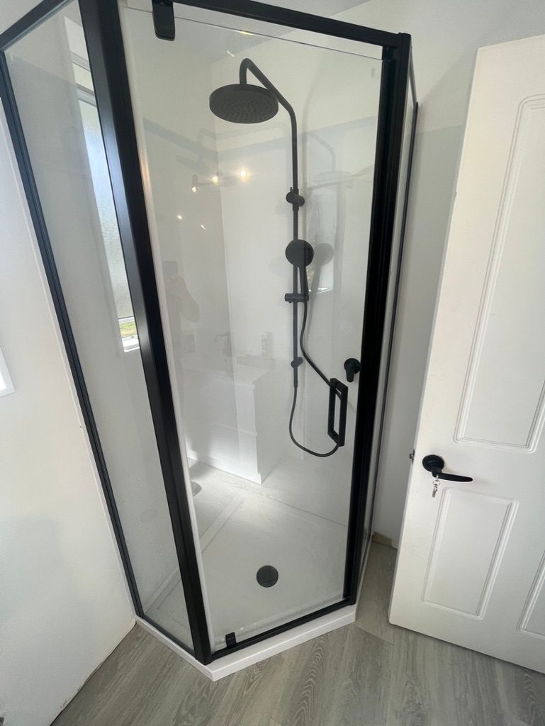 Modern black-framed glass shower
